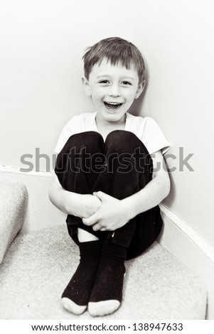 Happy 5 year old boy in black and white