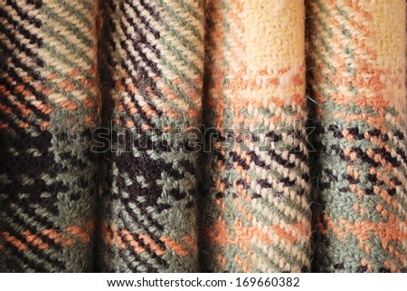Folded wool tartan material as a background image