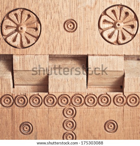 Close up of a carved wooden folding table