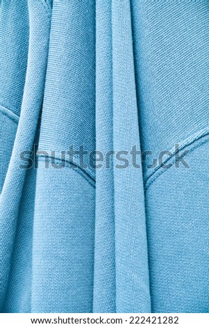 Close up of a folded hanging cotton jumper