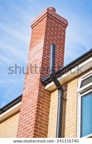 A modern chimney on a house