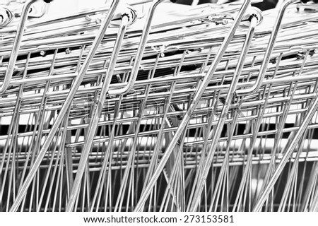Close up of metal shopping trolleys making an abstract pattern