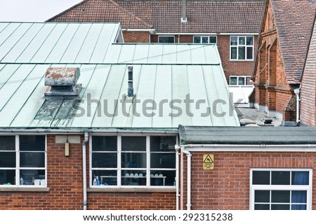 English school buildings with red bricks and tiled roofs