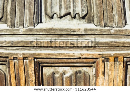 Part of an old wooden panelled door or wall
