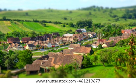 Traditional saxon village in Transylvania - Romania. Aerial view. Tilt-shift miniature effect applied. Crit / Deutsche-Kreutz village Photo stock © 