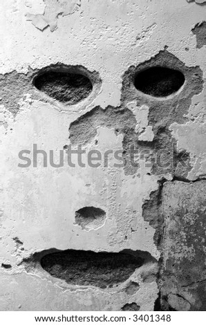 a face like image in an old plaster wall