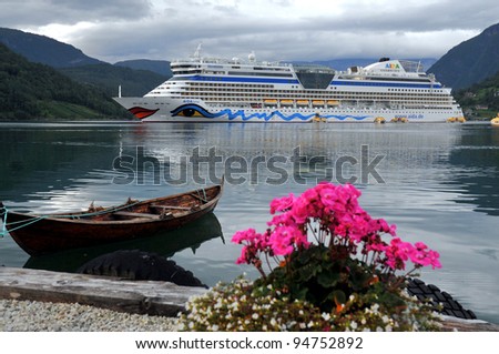 ULWIK, NORWAY - AUGUST 18: Cruise ship anchored in Ulwik fjord in Ulwik, Norway on August 18, 2010. AIDAluna belongs to the AIDA cruises company. 252 m long, has passenger capacity of 2050, 15 decks, 1096 cabins
