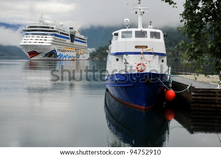 ULWIK, NORWAY - AUGUST 18: Cruise ship anchored in Ulwik fjord in Ulwik, Norway on August 18, 2010. AIDAluna belongs to the AIDA cruises company. 252 m long, has passenger capacity of 2050, 15 decks, 1096 cabins