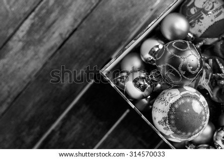 Close up image of a box of Christmas balls ready to be hanged on a Christmas tree.