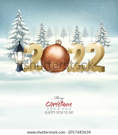 Merry Christmas and Happy New Year 2022. 3D numbers with a gold bauble, light bulb on a winter landscape background. Vector