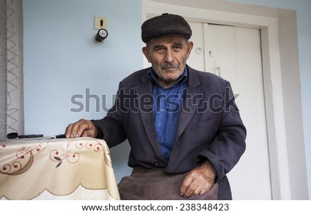 ARMENIA: 12 OCTOBER, 2014 - An old undefined Armenian man sitting in his village house in Armenia