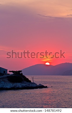 Beautiful Sea Sunset. Red Sun, Mountain, Deep Sea.