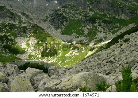 Lost glacial lakes with small water fall in Retezat Mountains - Romania