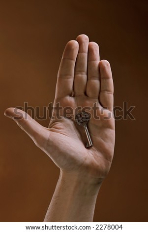 key in a human palm