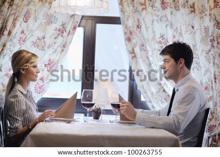 A young couple having dinner at a restaurant