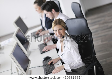 business people group with  headphones giving support in  help desk office to customers, manager giving training and education instructions