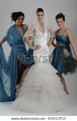 portrait of a three beautiful woman in wedding dress, bride and her friends bridesmaid