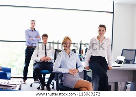 business woman  with her staff,  people group in background at modern bright office indoors