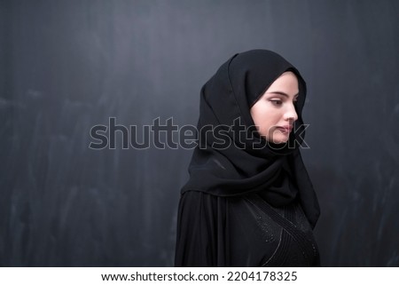 Similar – Image, Stock Photo Portrait of a Muslim woman in traditional cloth in front of wooden door frame