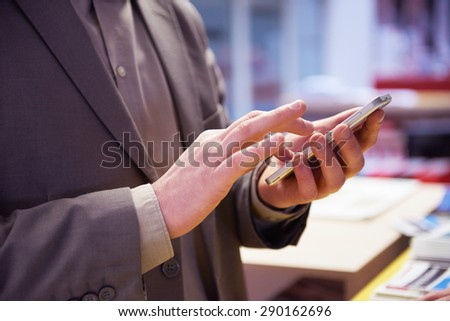 close up photo of business man work on  phone at office