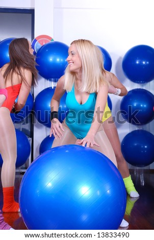 pretty girls working out in a fitness club