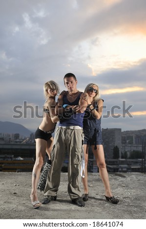 two woman and one man together in small gorup team