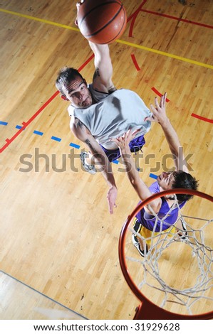 competition cencept with people who playing basketball in school gym
