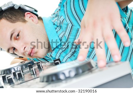 young dj man with headphones and compact disc dj equipment