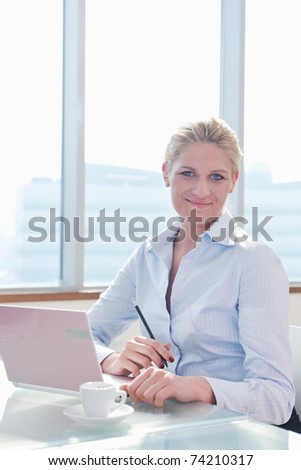 one happy young business woman working on laptop computer at  group team meeting at modern office