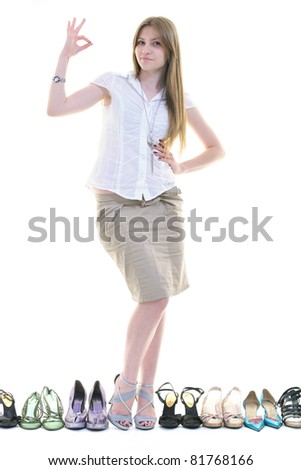 pretty young woman with buying shoes addiction, isolated on white background in studio