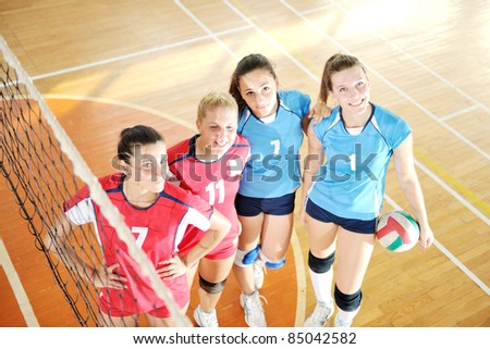 volleyball game sport with group of young beautiful  girls indoor in sport arena