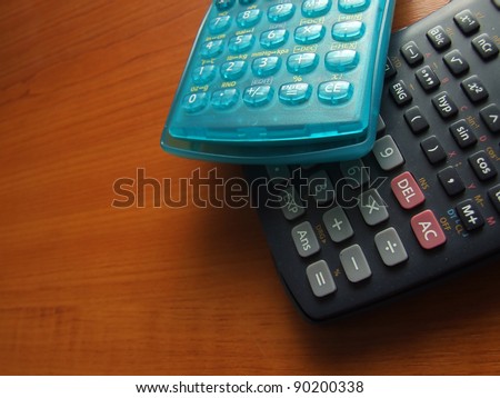 modern scientific calculator on the wooden table