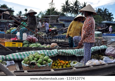 CAN THO - FEB 17: Unidentified fruit sellers at the Floating Market. With hundreds of boats, Cai Rang is the biggest floating market in the Mekong Delta. On Feb. 17, 2013, in Can Tho, Vietnam