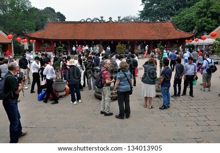HANOI - FEB 25: Unidentified tourists visiting the Temple of Literature in Hanoi. The temple dedicated to Confucius was Vietnam's first National University. On Feb. 25, 2013, in Hanoi, Vietnam