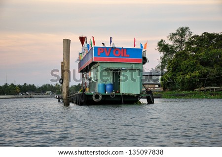 CAN THO - FEB 17: Floating gas station on Mekong river. Floating stations serve numerous motorboats of local fishermen with gasoline. On February 17, 2013 in Can Tho, Mekong delta, Vietnam
