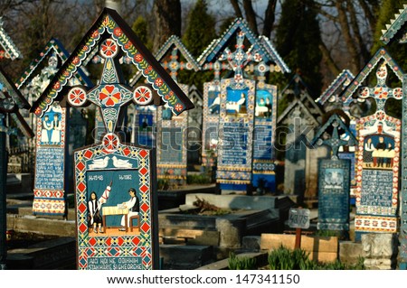 SAPANTA - MARCH 8: Painted crosses in Merry Cemetery after the renovation. Part of UNESCO is visited by crowds of tourists every year. March 8, 2004 in Sapanta Romania