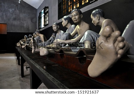 HANOI - FEB 25: Memorial jail interior with sculptures in Hoa Lo Prison depicting brutal treatment by French. Meditative area decorated with expressive sculptures. On Feb 25, 2013 in Hanoi, Vietnam