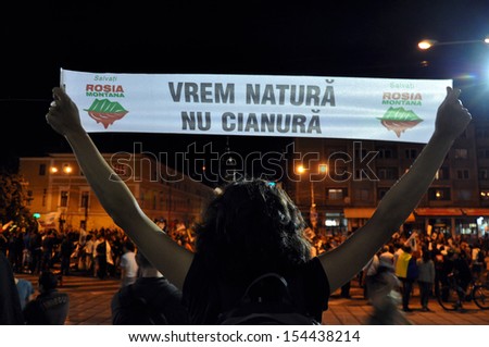 CLUJ -SEPT 8: People join a protest against the Romanian Government that passed a law allowing the gold extraction project at Rosia Montana against the people's will. On Sept 8, 2013 in Cluj, Romania