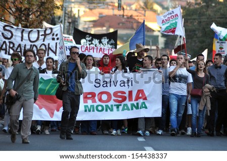 CLUJ -SEPT 8: People join a protest against the Romanian Government that passed a law allowing the gold extraction project at Rosia Montana against the people's will. On Sept 8, 2013 in Cluj, Romania