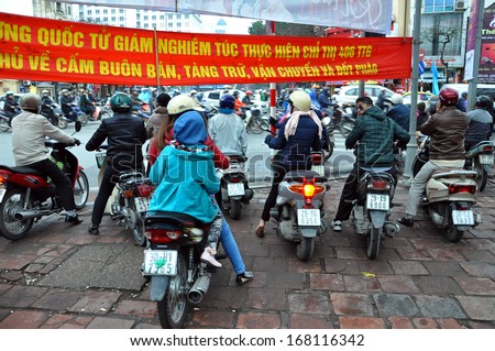 HANOI - MARCH 2: Chaotic road traffic in Hanoi, Vietnam. In the capital of Vietnam are more than 2 mil. motorbikes, the traffic is often congested. March 2, 2013, Hanoi, Vietnam