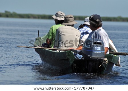 SULINA - JUNE 25: Tourists take a birdwatching boat trip in the Danube Delta Biosphere Reserve. Danube delta is the second largest river delta in Europe. On June 25 in Sulina,Romania