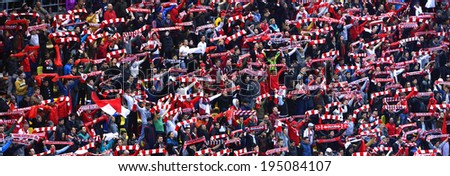 BUCHAREST - APRIL 17: Crowd of soccer fans of Dinamo Bucharest during a match against Steaua Bucharest, in the National Arena stadium, final score: 1-1. On April 17, 2014 in Bucharest, Romania