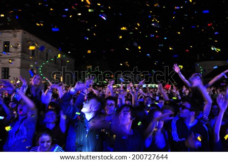 BONTIDA - JUNE 22: Crowd of partying people during a live concert at Electric Castle Festival on June 22, 2014 in the Banffy castle in Bontida, Romania