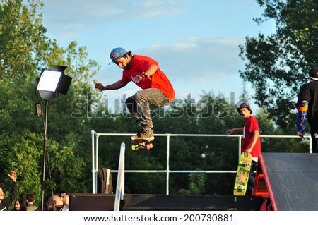 BONTIDA - JUNE 19: Unidentified skateboarder doing a slide trick during the Skateboard Competition at Electric Castle Festival on June 19, 2014 in the Banffy castle in Bontida, Romania