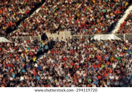 Crowd of people at a football match - blurred image