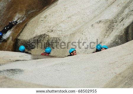 PURCARACCIA CANYON, CORSICA - AUGUST 28: An extreme sports team participates  in a canyoning contest on the famous waterfalls of Purcaraccia valley, on August 28, 2010 in Corsica, France
