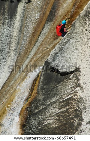 PURCARACCIA CANYON, CORSICA - AUGUST 28: An extreme sports team member participates  in a canyoning contest on the famous waterfalls of Purcaraccia valley, on August 28, 2010 in Corsica, France