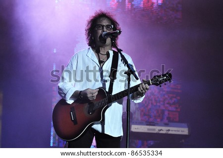 CLUJ NAPOCA, ROMANIA – OCTOBER 9: Singer Mike Craft from Smokie pop-rock band performs live at Cluj Arena Grand Opening concert on October 9, 2011 in Cluj-Napoca, Romania