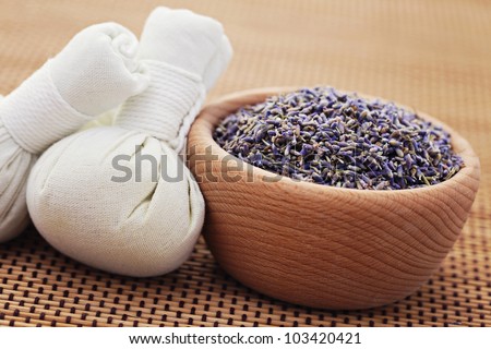 bowl of lavender and massage stamps - beauty treatment