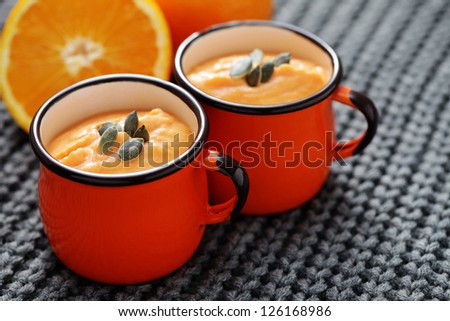 bowl of delicious pumpkin soup with orange - food and drink